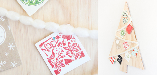 Modern plywood Christmas tree hung with removable fasteners and decorated with yarn