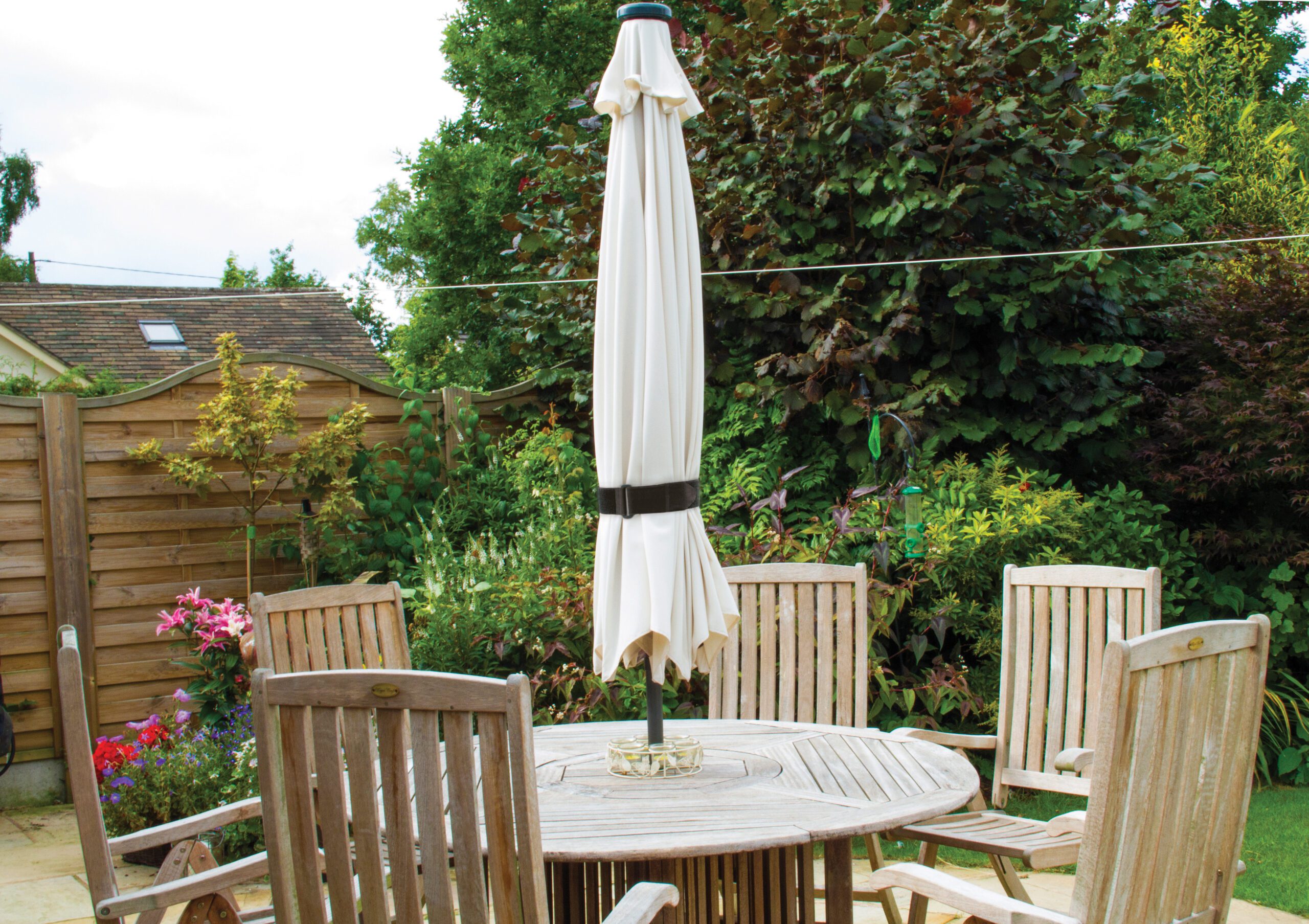 Garden umbrella secured with durable straps from the VELCRO® Brand.