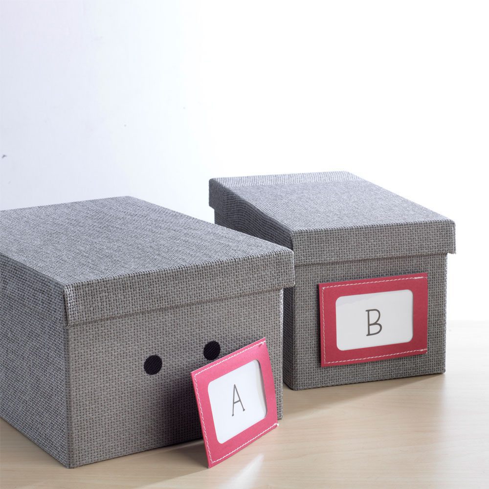 Storage boxes labeled with VELCRO® Brand Sticky Dots.