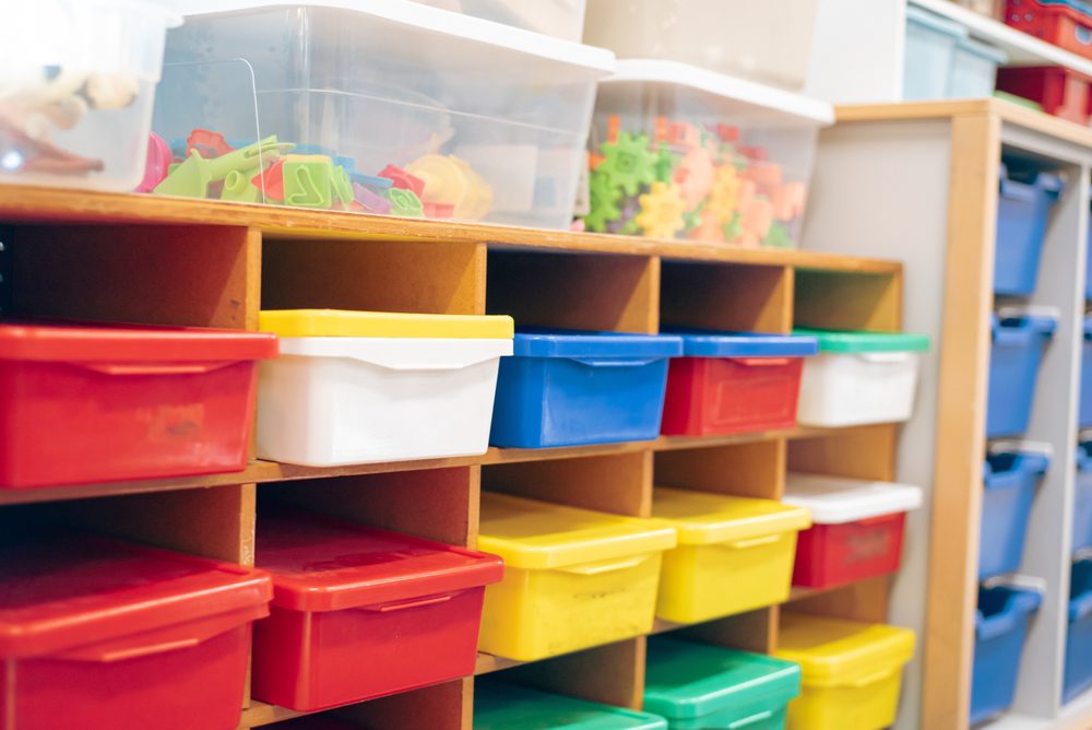 Color-coded trays in classroom for homework, classwork and assignments.