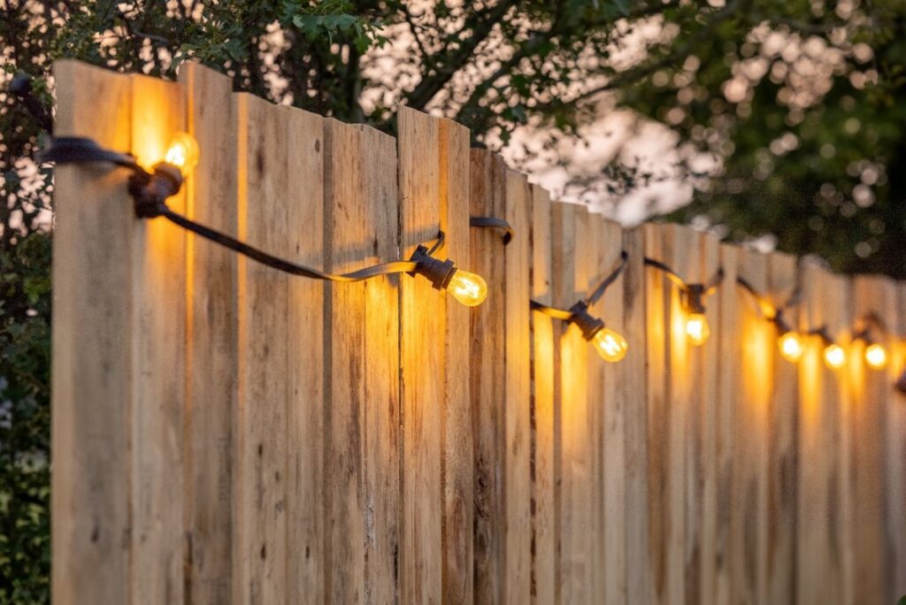 string lights hung up around a fence