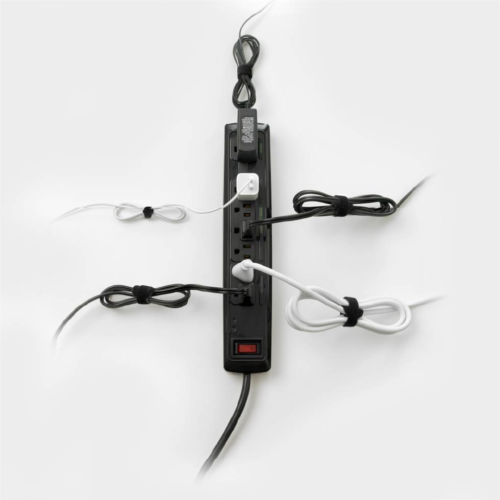 Extension cord on white background with cables wrapped using VELCRO® Brand ONE-WRAP® Ties.