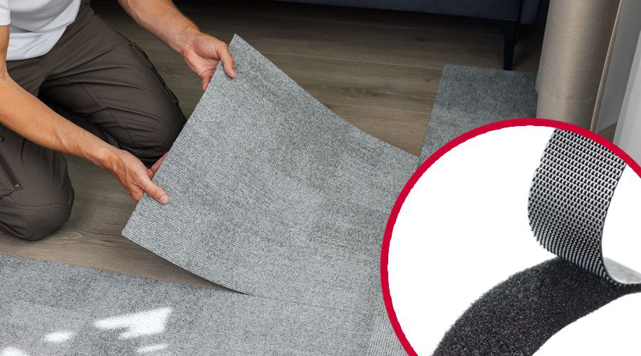Installer placing carpet tiles using VELCRO® Brand hook and loop fasteners, showcasing a high quality, flexible alternative to industrial adhesives and hardware that streamlines the manufacturing process and reduces hidden costs.